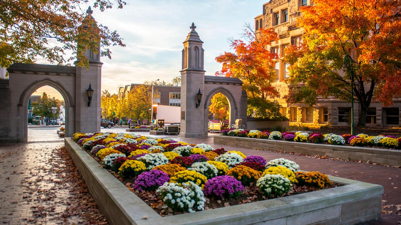 A view of downtown Bloomington, Indiana featuring historic buildings, local shops, and modern infrastructure. Bloomington understands the need for security solutions built by imperial surveillance.