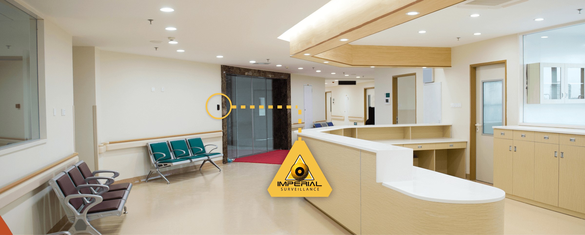 Hospital reception desk and waiting area, with a camera by the doors highlighted by an Imperial Surveillance callout